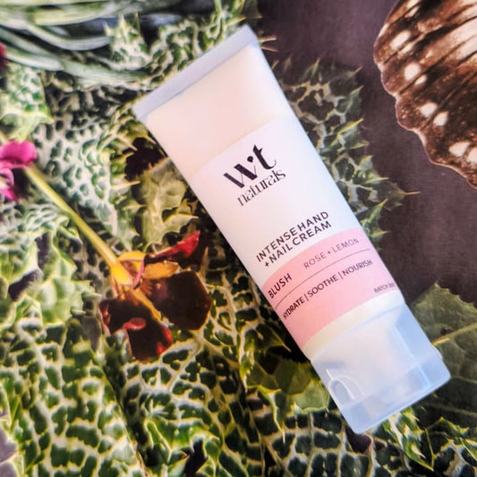 A tube of Wriggly Tin Naturals Intense Hand + Nail Cream with Botanical Back ground