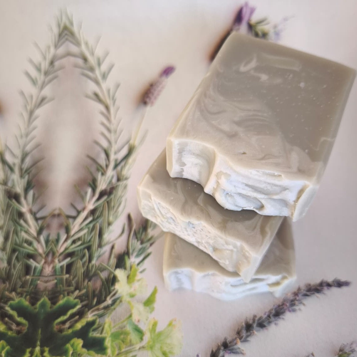 Handmade goat milk soap bar in green with gentle cream marbling